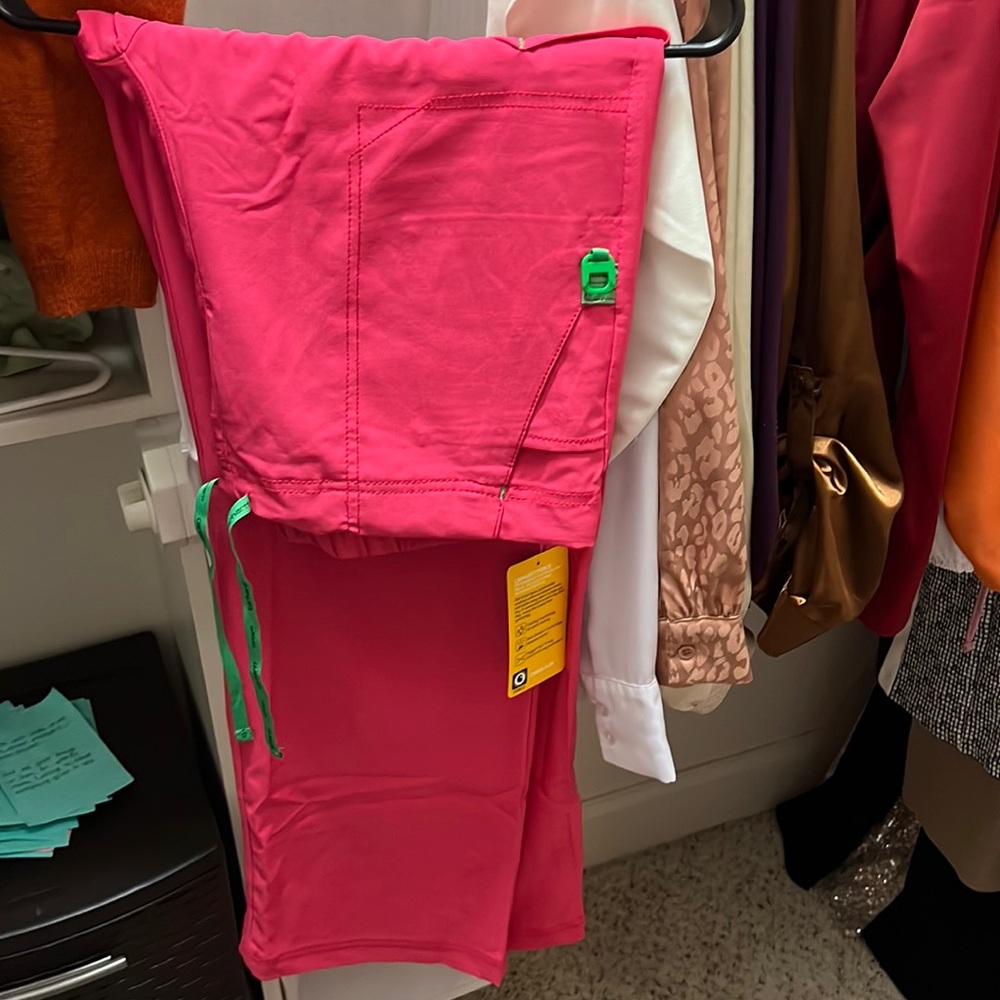 Pink Carhartt scrub pants. Never been worn and the tags are still on